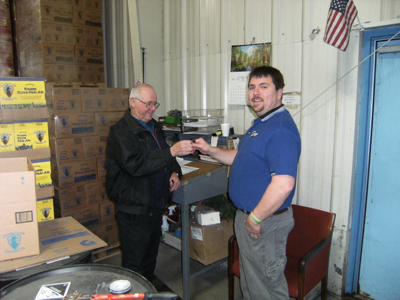 Dick giving Brian the keys on his last day of work.   Dick retired the next day 